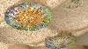 Mosaic Rosettes illustrating two of the Four Seasons under Park Guell
Photo by M. Favermann, All Rights Reserved