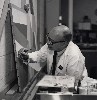 The artist at work on a restoration.