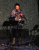 Demonstrating her unique instruments.