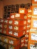 Stacks of captioned boxes by Ward Shelley are crammed into the museum&rsquo;s library.